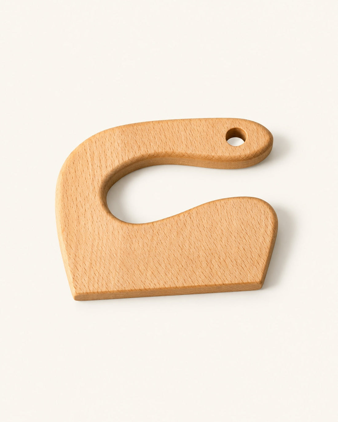Le couteau en bois, vu de trois quarts.
